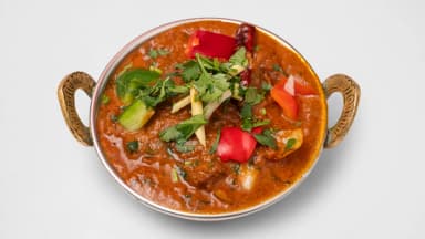 Chicken karahi curry with peppers and fresh coriander in a copper karahi at Taste of Himalayan, Rowley Regis
