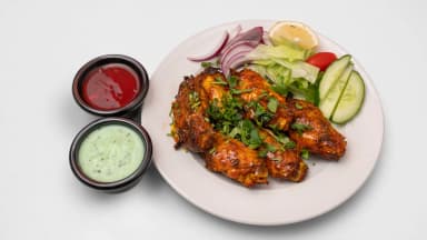 Clay-oven roasted chicken wings with salad, mint sauce and chilli sauce at Taste of Himalayan, Rowley Regis